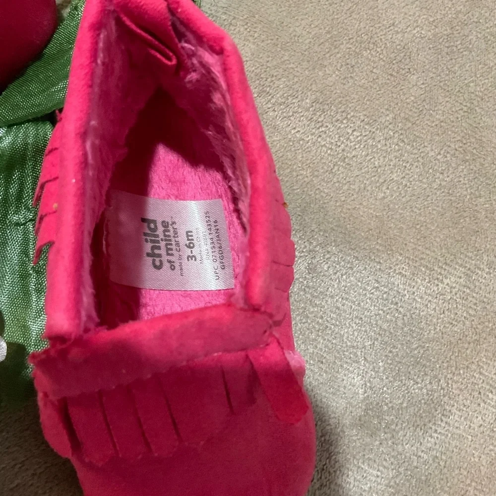 Child of Mine Pink Fringed Baby Moccasins with fleece lining.